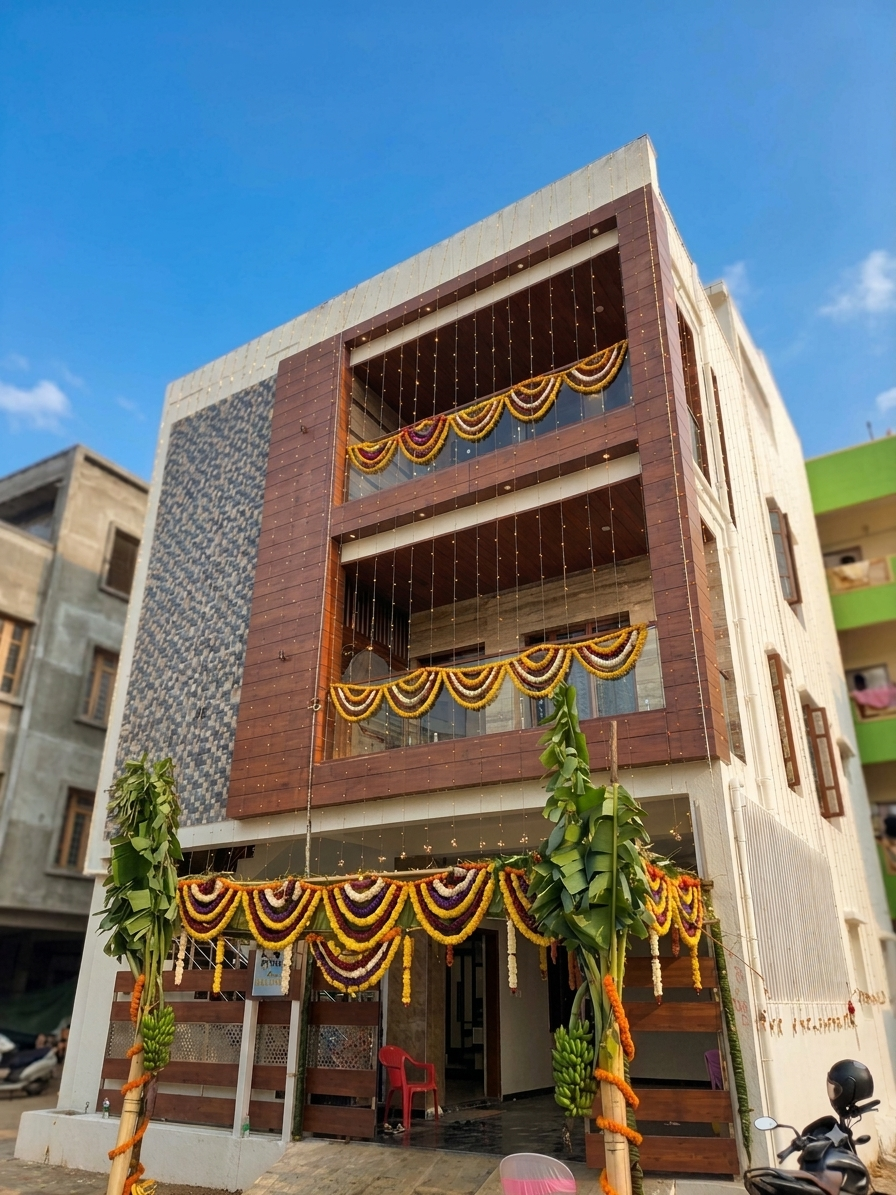 Guruprasad Residence, a completed three-storey independent house in Maragondanahalli with a wood-clad, glass-balcony façade.